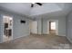 Spacious main bedroom featuring neutral carpet and tray ceiling at 12604 Cardinal Point Rd, Charlotte, NC 28269