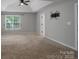 Large main bedroom offering neutral carpet, tray ceiling, and ample natural light at 12604 Cardinal Point Rd, Charlotte, NC 28269