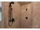 Beautiful walk-in shower featuring a rainfall shower head and custom tile work at 12604 Cardinal Point Rd, Charlotte, NC 28269