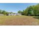 Expansive backyard featuring plenty of green space on a sunny day at 12842 Plaza Road Ext, Charlotte, NC 28215