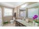 Well-lit bathroom with granite countertop, framed mirror, neutral color scheme and decorative accents at 12842 Plaza Road Ext, Charlotte, NC 28215