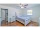 Comfortable bedroom featuring hardwood floors, ample natural light, and neutral color scheme at 12842 Plaza Road Ext, Charlotte, NC 28215