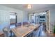 Bright dining room with hardwood floors, ceiling lighting, and open layout at 12842 Plaza Road Ext, Charlotte, NC 28215