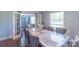 Bright dining room featuring hardwood floors and adjacent living room at 12842 Plaza Road Ext, Charlotte, NC 28215