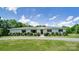 Charming ranch-style home featuring manicured lawn and mature landscaping on a sunny day at 12842 Plaza Road Ext, Charlotte, NC 28215