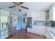 Bright kitchen with modern stainless steel appliances, ample cabinet space, and convenient back door access at 12842 Plaza Road Ext, Charlotte, NC 28215