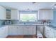 Functional kitchen with abundant natural light, stainless steel appliances, and sleek countertops for a modern feel at 12842 Plaza Road Ext, Charlotte, NC 28215
