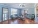 Inviting living room features hardwood floors, ceiling fan, and ample natural light at 12842 Plaza Road Ext, Charlotte, NC 28215