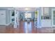 Spacious open-concept living area connects the living room, kitchen, and features elegant architectural columns at 12842 Plaza Road Ext, Charlotte, NC 28215