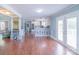 Bright living space with seamless transitions between the seating area, kitchen, and outdoor access at 12842 Plaza Road Ext, Charlotte, NC 28215