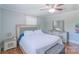 Comfortable main bedroom with a ceiling fan, window, and closet space at 12842 Plaza Road Ext, Charlotte, NC 28215