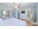 Comfortable main bedroom featuring a ceiling fan, closet, and ample lighting at 12842 Plaza Road Ext, Charlotte, NC 28215