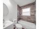 Bathroom featuring a tub, modern vanity, and stylish wood-look plank accent wall at 129 Wilson St, Chester, SC 29706