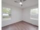 A bright bedroom with wood-look flooring, neutral walls, and windows that provide ample natural light at 129 Wilson St, Chester, SC 29706
