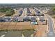 Aerial view of homes in a neighborhood with a pond at 13102 Petrel Pl, Charlotte, NC 28278