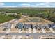Aerial view of a residential neighborhood featuring a pond and tree-lined streets, offering a picturesque setting at 13102 Petrel Pl, Charlotte, NC 28278