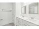 A bathroom featuring double vanity, with modern fixtures, and a shower and bath combination at 13102 Petrel Pl, Charlotte, NC 28278