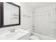 Well-lit bathroom featuring modern fixtures, a combined shower and tub, vanity and ample storage at 13102 Petrel Pl, Charlotte, NC 28278