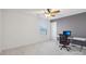 Office room with ceiling fan, white walls and trim, small window and chair at a white desk at 13102 Petrel Pl, Charlotte, NC 28278