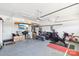 Spacious garage featuring organized storage, exercise equipment, and a projector for entertainment at 13102 Petrel Pl, Charlotte, NC 28278
