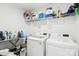 Functional laundry room with modern washer and dryer at 13102 Petrel Pl, Charlotte, NC 28278