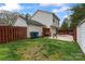 Large backyard with a patio, lush grass, a wooden fence, and ample space for activities at 140 Camforth Dr, Mooresville, NC 28117