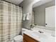 Well-lit bathroom featuring a neutral shower curtain, modern vanity, and clean fixtures at 140 Camforth Dr, Mooresville, NC 28117