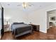 Well-lit bedroom with vaulted ceiling, hardwood floors, and natural light at 140 Camforth Dr, Mooresville, NC 28117