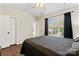 Cozy bedroom with vaulted ceiling, hardwood floors, and a bright, airy feel at 140 Camforth Dr, Mooresville, NC 28117