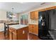 Bright eat-in kitchen boasts stainless steel appliances, tile backsplash, and access to the backyard at 140 Camforth Dr, Mooresville, NC 28117