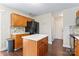 Well-equipped kitchen featuring light-colored cabinetry, stainless steel appliances, and an eat-in island at 140 Camforth Dr, Mooresville, NC 28117