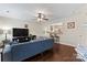 Inviting living room featuring stylish furniture, an open layout, modern decor, and dark hardwood floors at 140 Camforth Dr, Mooresville, NC 28117
