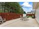 Spacious patio with outdoor seating and a fenced yard, perfect for entertaining at 140 Camforth Dr, Mooresville, NC 28117
