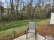 Charming backyard features scenic greenery, mature trees, and an outdoor seating area at 14022 Clayborn St, Midland, NC 28107