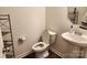 Simple half bath with a pedestal sink, toilet, and shelf at 14022 Clayborn St, Midland, NC 28107