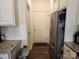 Functional kitchen area featuring ample cabinetry, stainless steel refrigerator, and subway tile backsplash at 14022 Clayborn St, Midland, NC 28107
