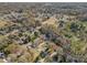 An aerial view showcasing a neighborhood with mature trees and well-spaced homes at 1421 Sherwood Dr, Kannapolis, NC 28081