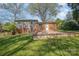 Well-manicured backyard with a flat lawn and a patio, ideal for outdoor living at 1421 Sherwood Dr, Kannapolis, NC 28081