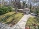 Inviting home featuring mature trees, well-kept lawn, split level and extended driveway at 1421 Sherwood Dr, Kannapolis, NC 28081