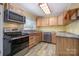 Kitchen with light wood cabinets, stainless steel appliances, and granite countertops at 1421 Sherwood Dr, Kannapolis, NC 28081