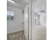 View into carpeted bedroom from the walk-in closet with vaulted ceiling at 14256 Drake Watch Ln, Charlotte, NC 28262
