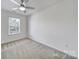 Bedroom featuring carpeted floors, a ceiling fan, and natural light at 14256 Drake Watch Ln, Charlotte, NC 28262