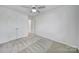 Bedroom featuring carpeted floors, closet, and bright natural light at 14256 Drake Watch Ln, Charlotte, NC 28262