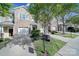 A row of townhomes showcasing stone accents, garages, and well-maintained landscaping at 14256 Drake Watch Ln, Charlotte, NC 28262
