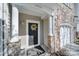 Charming front door with a decorative wreath and stone accents at 14256 Drake Watch Ln, Charlotte, NC 28262