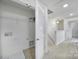Bright Laundry room with shelving at 14256 Drake Watch Ln, Charlotte, NC 28262