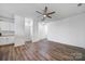 A bright and open living room featuring wood floors and ample space at 14256 Drake Watch Ln, Charlotte, NC 28262