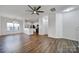 Open-concept living space with modern decor, kitchen view, and ample natural light at 14256 Drake Watch Ln, Charlotte, NC 28262