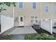 Cozy patio area with sliding glass door access to the home at 14256 Drake Watch Ln, Charlotte, NC 28262