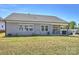 Backyard with a covered patio, lawn, and a view of the home's exterior with symmetrical window placements at 152 Amerson Dr, Rock Hill, SC 29730